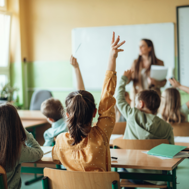 teacher with students in classroom