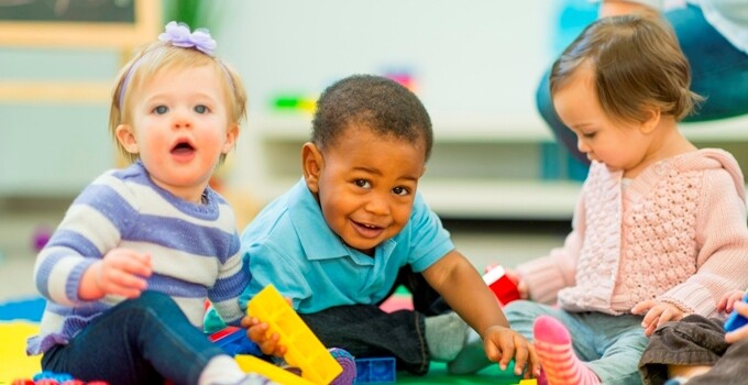 three toddlers playing together