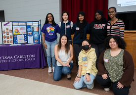 a group of eight OCDSB students posing for a photo at the Mental Health Champions event